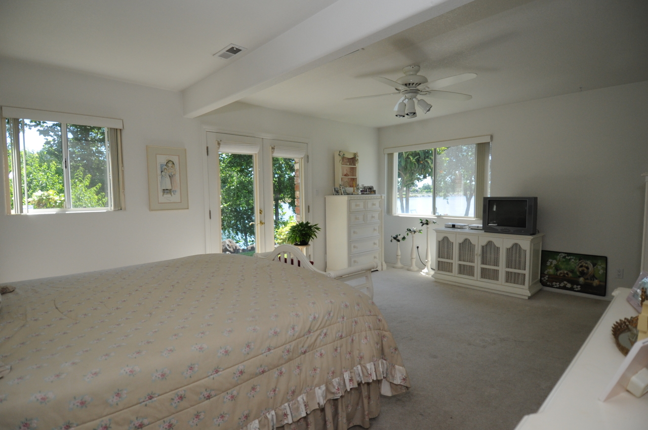 6471 Riverside Drive Redding, CA 96001 - Photo 31 of 56 a living room with furniture a flat screen tv and a fireplace