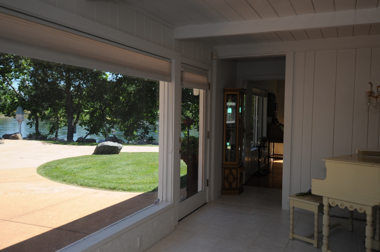 6471 Riverside Drive Redding, CA 96001 - Photo 37 of 56 a view of a porch with furniture and yard