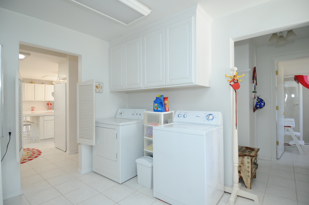 6471 Riverside Drive Redding, CA 96001 - Photo 39 of 56 a utility room with cabinets washer and dryer