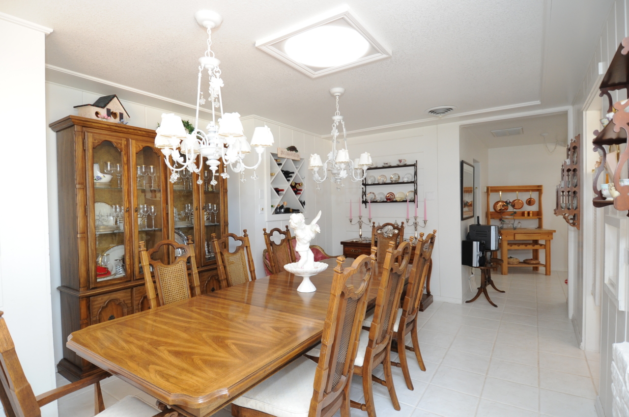 6471 Riverside Drive Redding, CA 96001 - Photo 40 of 56 a view of a dining room with furniture and chandelier