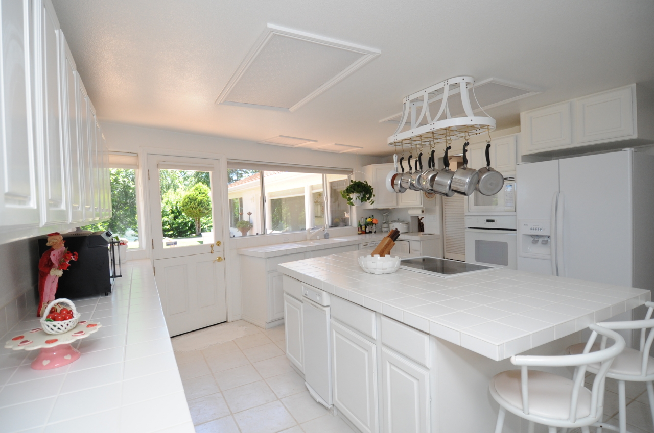 6471 Riverside Drive Redding, CA 96001 - Photo 44 of 56 a kitchen with a sink cabinets and window