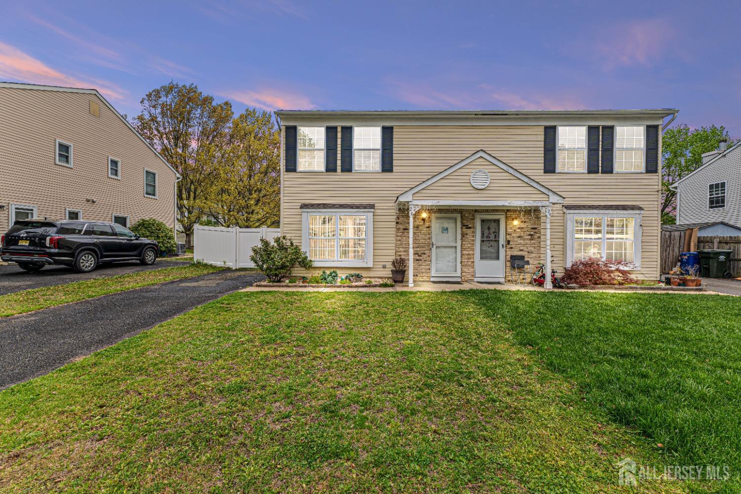 a front view of a house with a yard