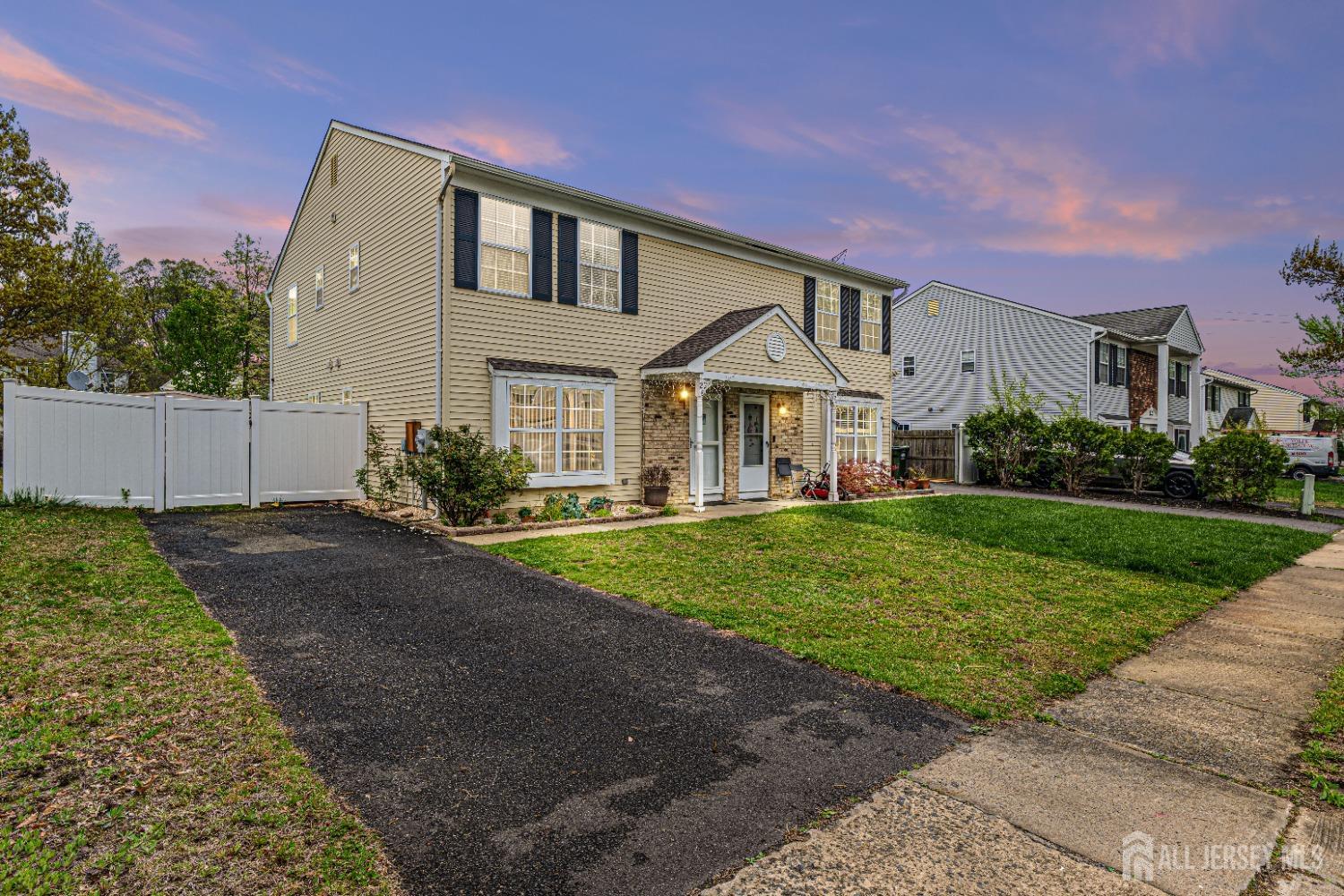 26 Brewster Circle Old Bridge, NJ 08857 - Photo 2 of 43 a front view of a house with a yard and garage