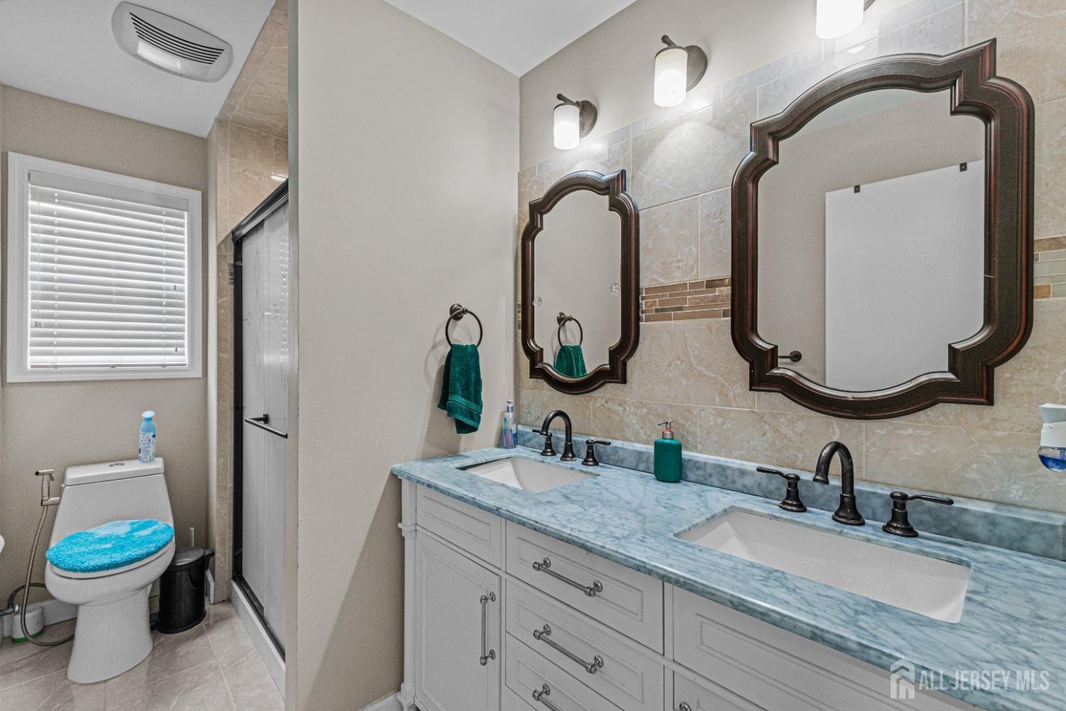 26 Brewster Circle Old Bridge, NJ 08857 - Photo 25 of 43 a bathroom with a granite countertop toilet sink and mirror