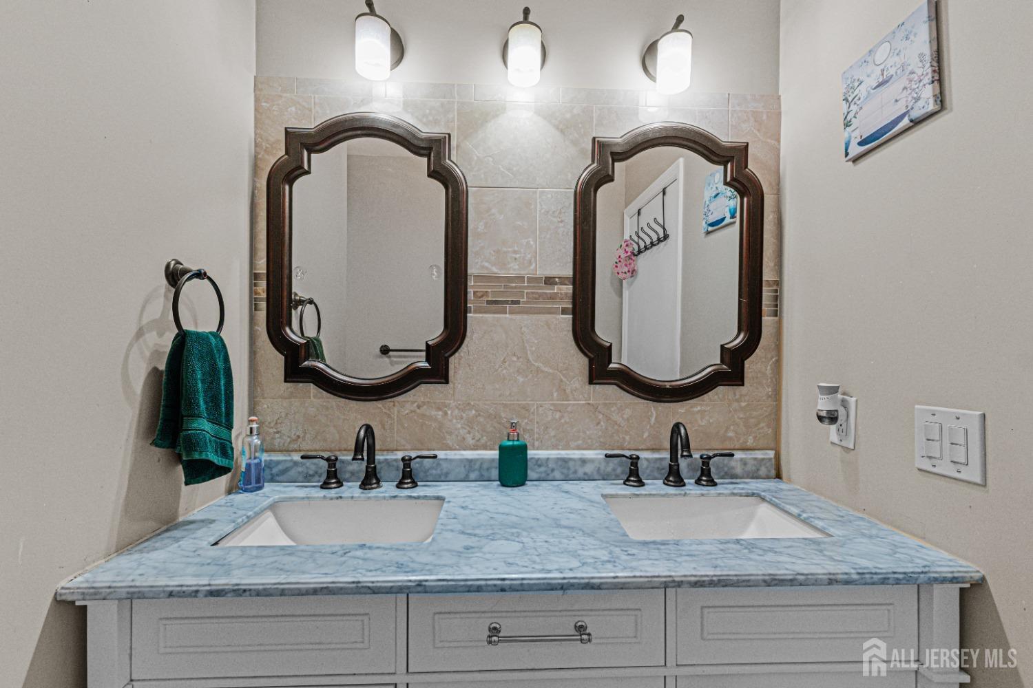 26 Brewster Circle Old Bridge, NJ 08857 - Photo 26 of 43 a bathroom with double vanity sinks and a granite countertop
