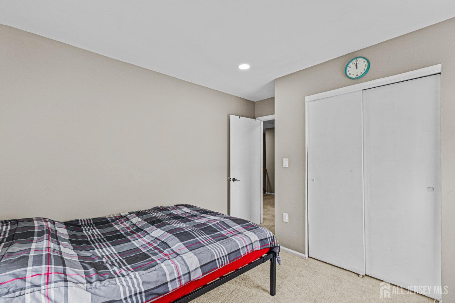 26 Brewster Circle Old Bridge, NJ 08857 - Photo 29 of 43 a bedroom with a bed and a dresser