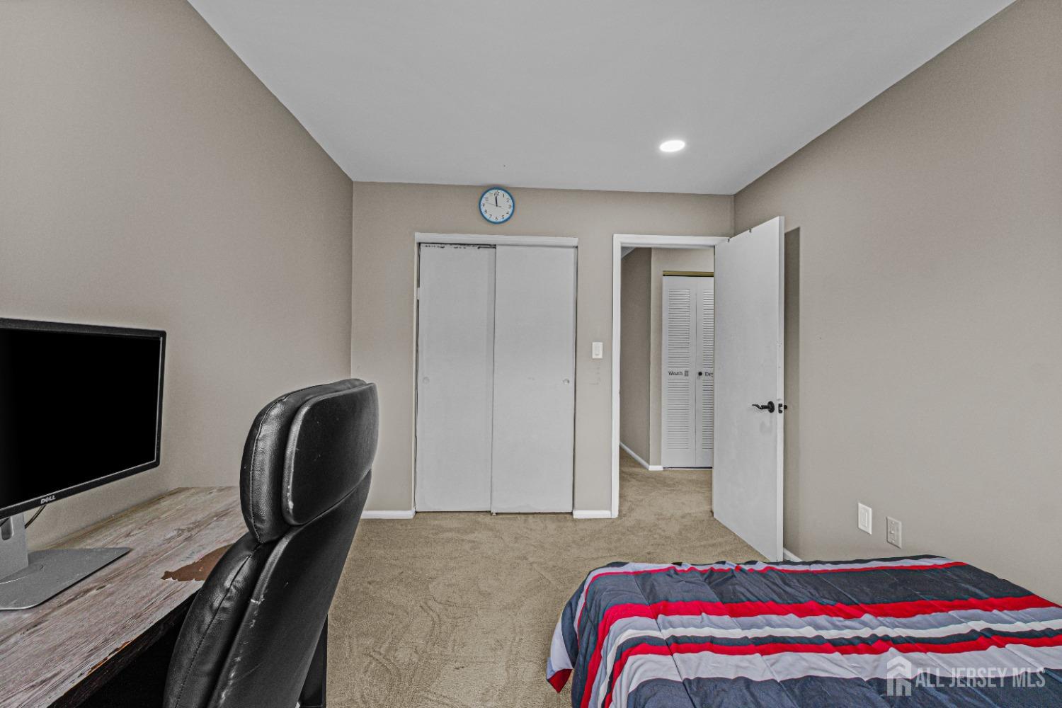 26 Brewster Circle Old Bridge, NJ 08857 - Photo 30 of 43 a bedroom with a bed and a flat screen tv