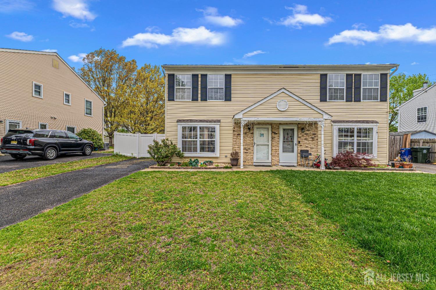 26 Brewster Circle Old Bridge, NJ 08857 - Photo 3 of 43 a front view of a house with a yard