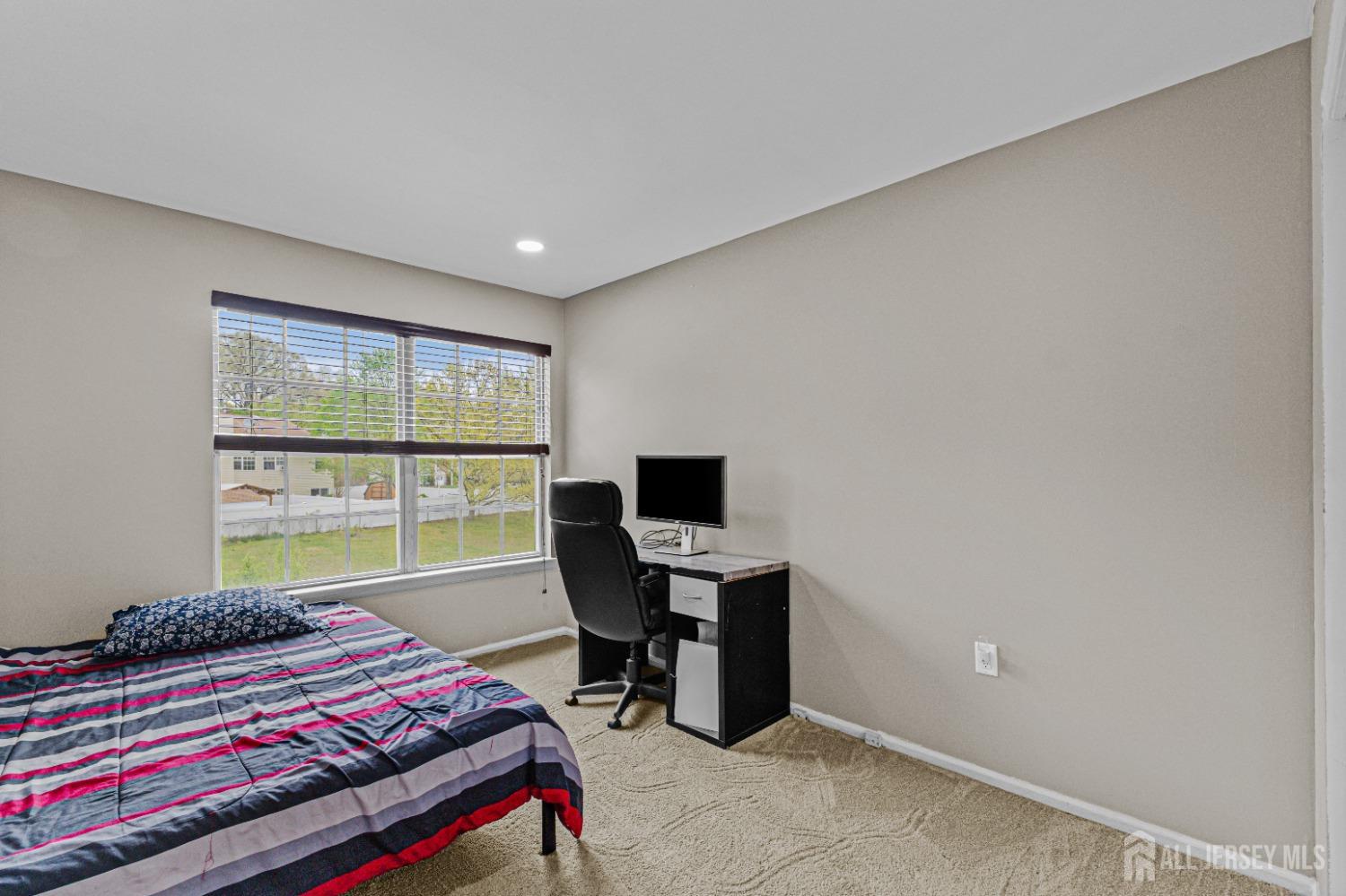 26 Brewster Circle Old Bridge, NJ 08857 - Photo 31 of 43 a bedroom with a bed and large window