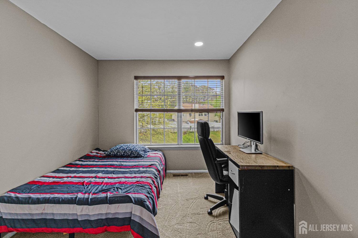 26 Brewster Circle Old Bridge, NJ 08857 - Photo 32 of 43 a bedroom with a bed and a window