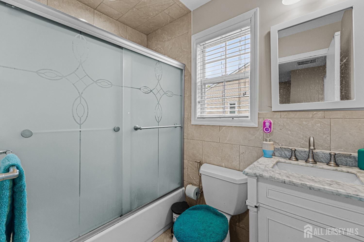 26 Brewster Circle Old Bridge, NJ 08857 - Photo 33 of 43 a bathroom with a granite countertop sink toilet and shower