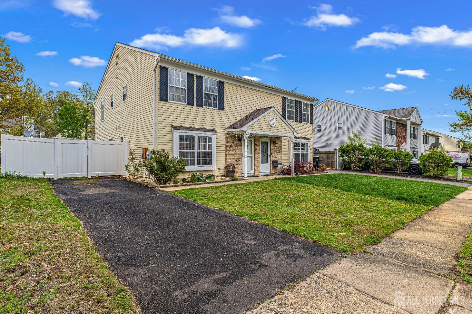 26 Brewster Circle Old Bridge, NJ 08857 - Photo 4 of 43 a front view of a house with a yard
