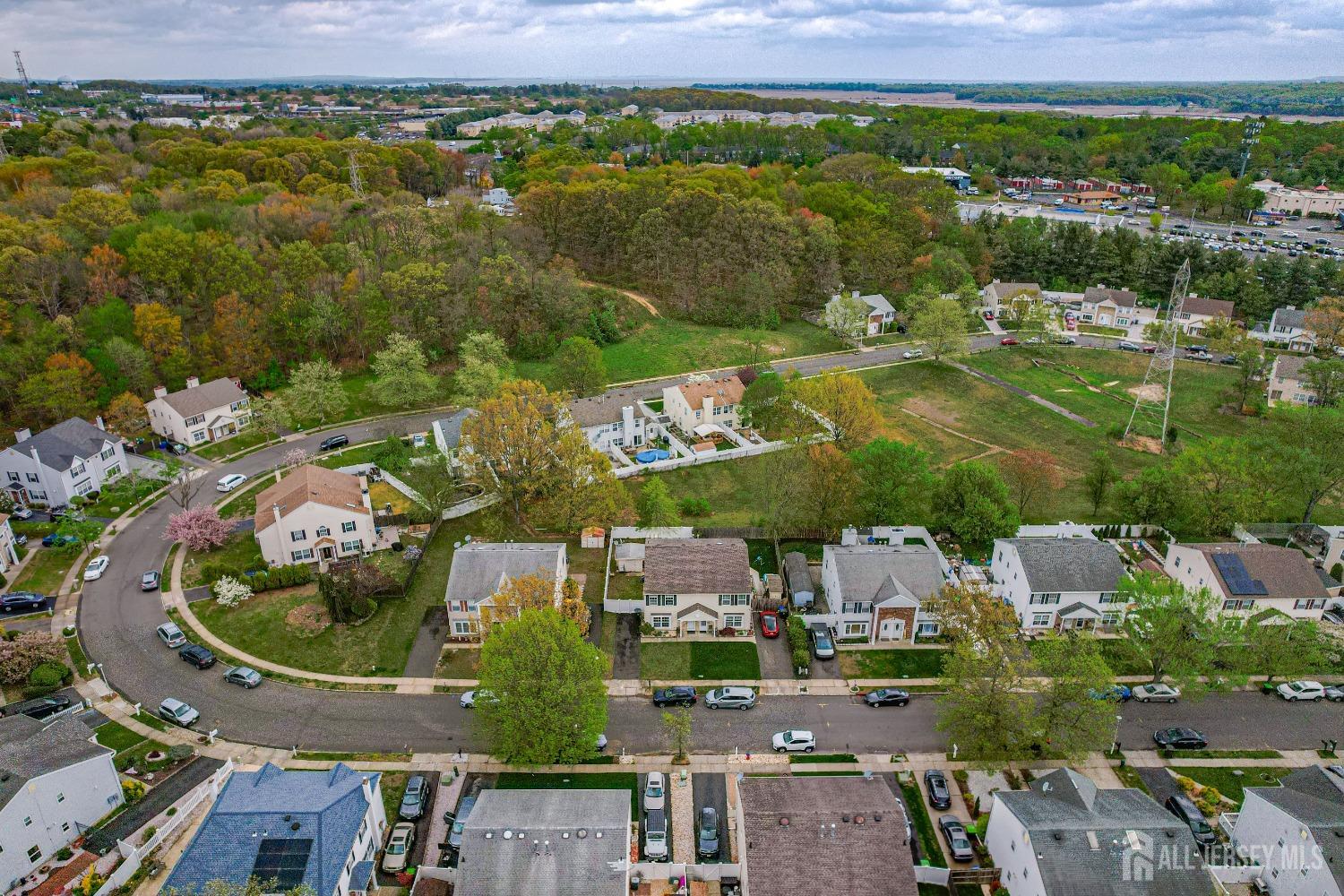 26 Brewster Circle Old Bridge, NJ 08857 - Photo 5 of 43 an aerial view of residential houses with outdoor space and lake view