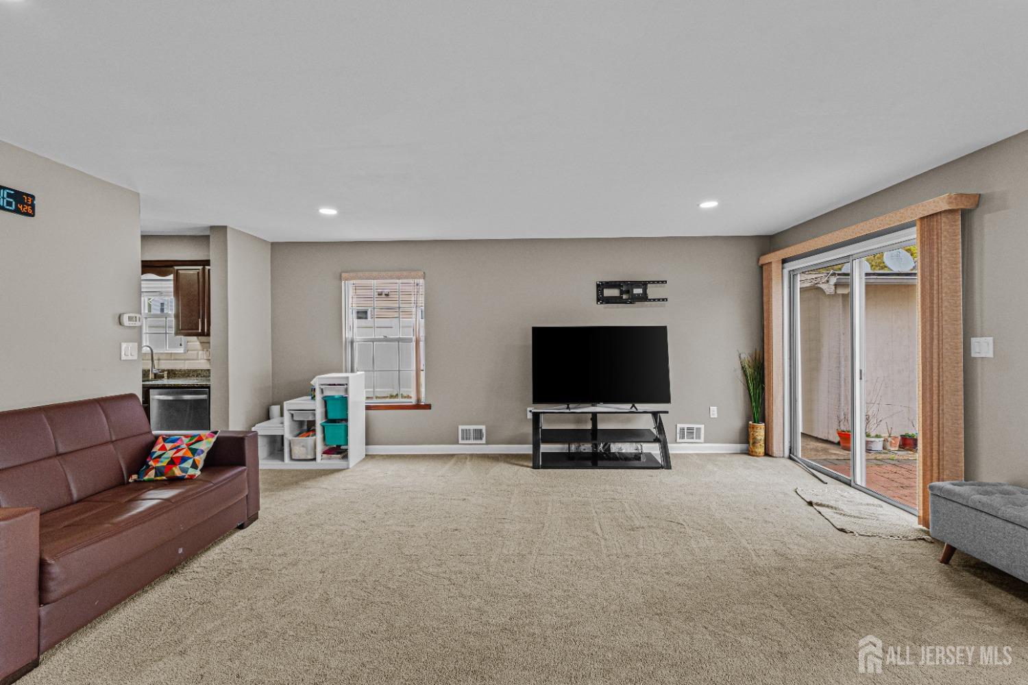 26 Brewster Circle Old Bridge, NJ 08857 - Photo 8 of 43 a living room with furniture and a flat screen tv
