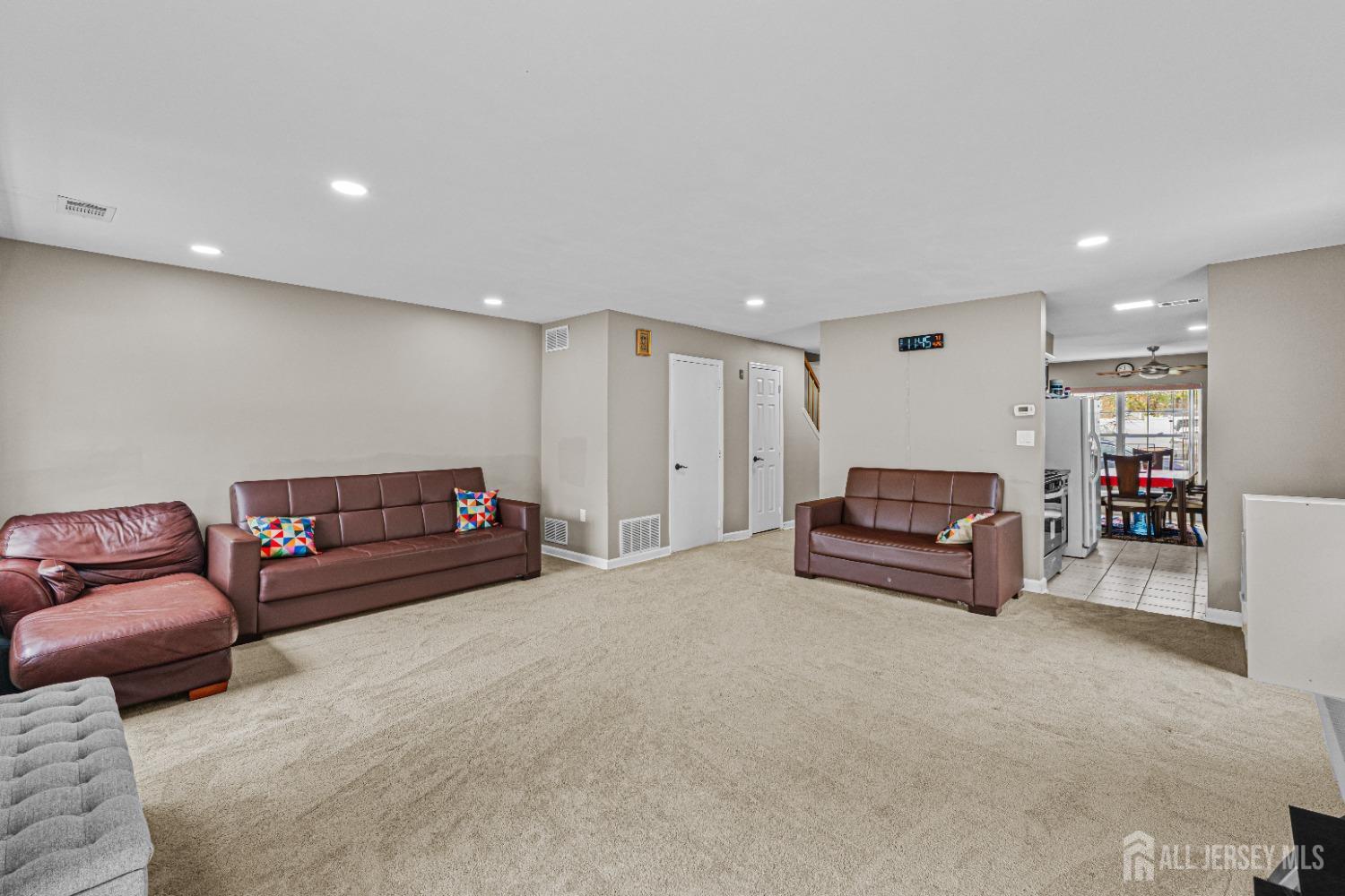 26 Brewster Circle Old Bridge, NJ 08857 - Photo 10 of 43 a living room with furniture and a flat screen tv