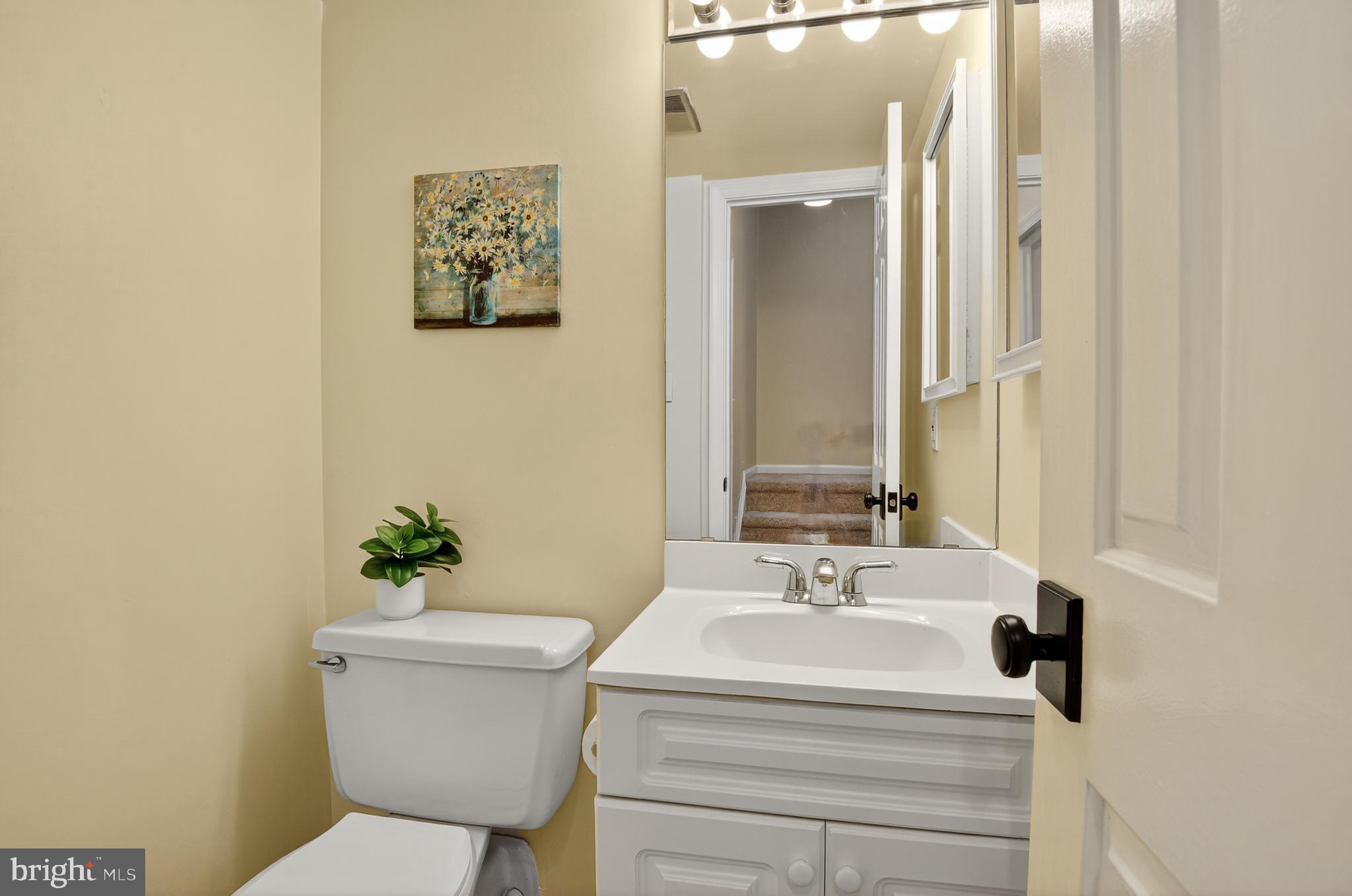 1493 A Street Northeast Washington, DC 20002 - Photo 13 of 31 a bathroom with a sink toilet and mirror