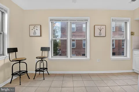 a view of a livingroom with furniture and windows