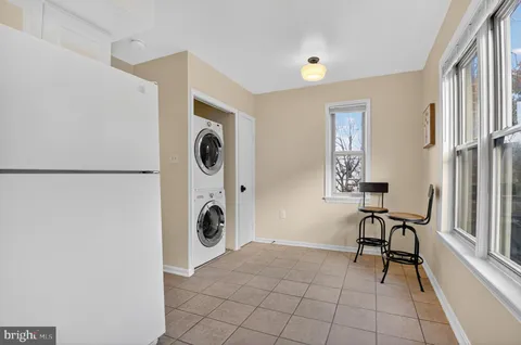 a view of a livingroom with furniture and a window