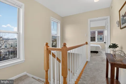 a view of a livingroom with furniture and windows