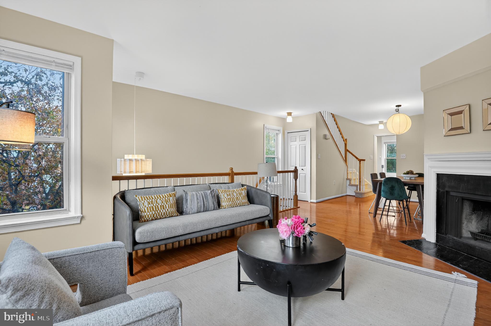 1493 A Street Northeast Washington, DC 20002 - Photo 2 of 31 a living room with furniture and a fireplace