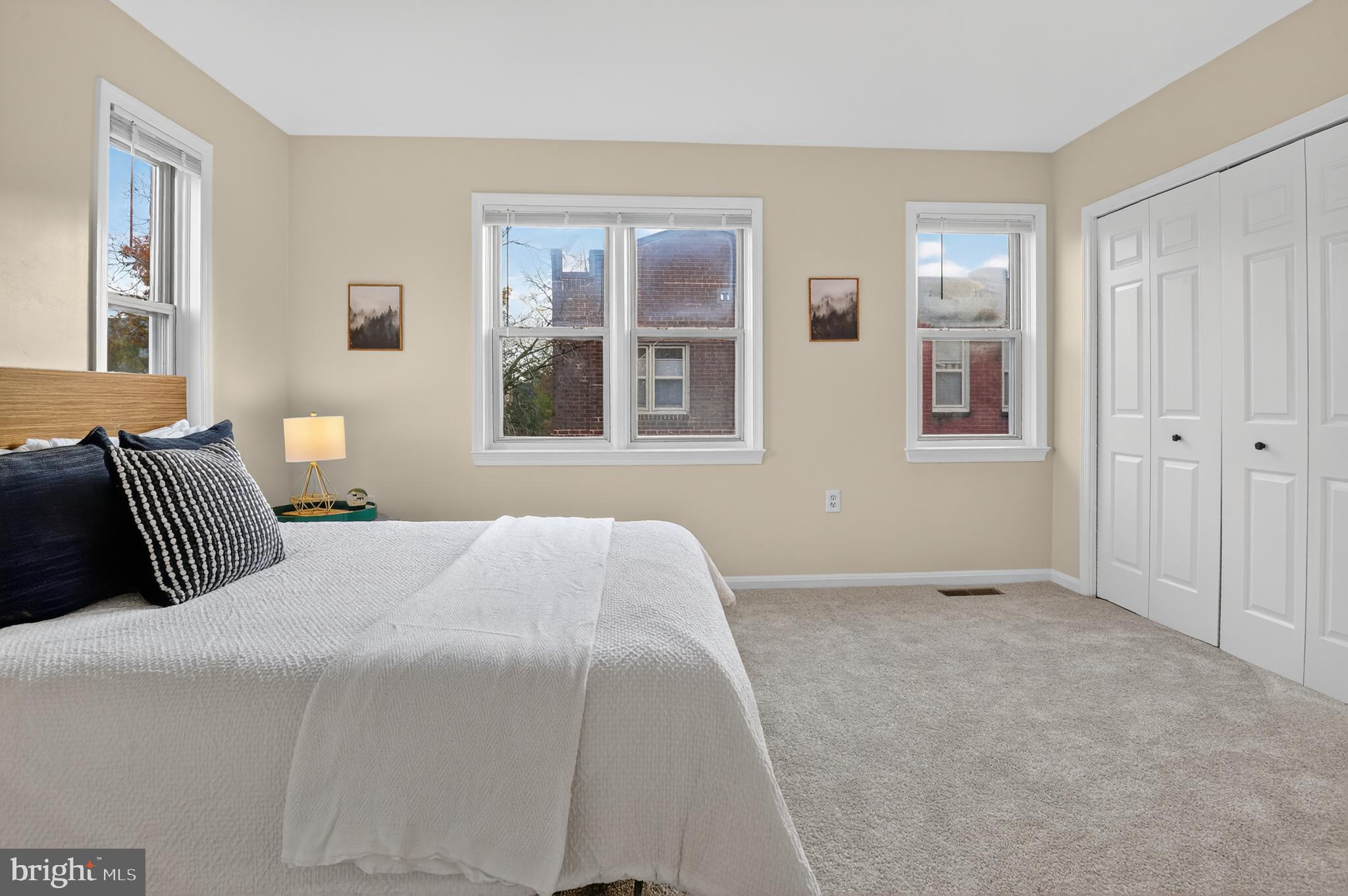 1493 A Street Northeast Washington, DC 20002 - Photo 24 of 31 a bedroom with a bed and a window
