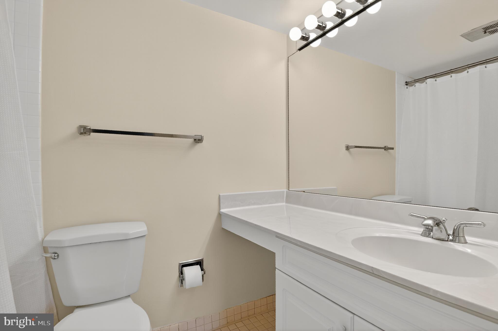 1493 A Street Northeast Washington, DC 20002 - Photo 28 of 31 a bathroom with a sink toilet and shower