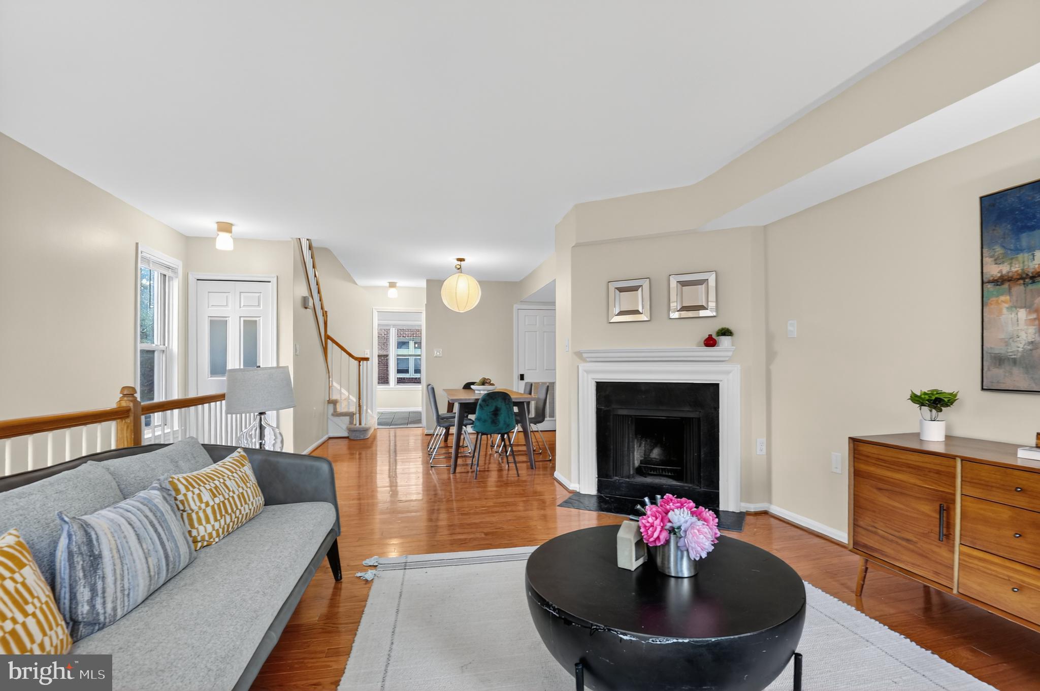 1493 A Street Northeast Washington, DC 20002 - Photo 4 of 31 a living room with furniture a fireplace and a flat screen tv