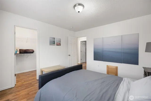 a bedroom with a bed and a view of bathroom