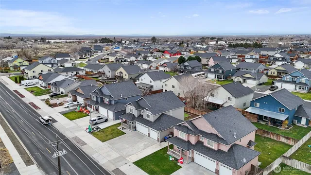 an aerial view of a city with lots of residential buildings