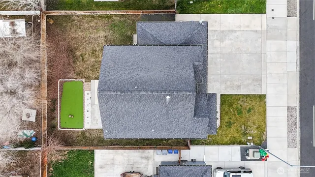 a aerial view of a house with a yard
