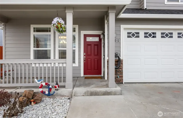 a front view of a house with outdoor seating