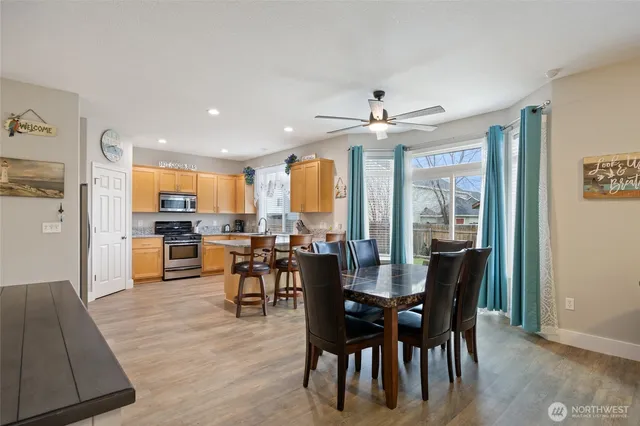 a view of a dining room with furniture window and outside view