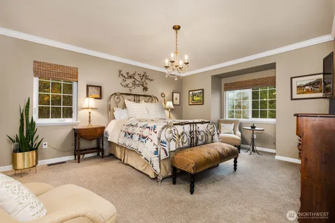 a bedroom with a bed furniture and a window