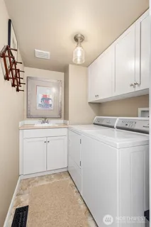 a room with a cabinets and window