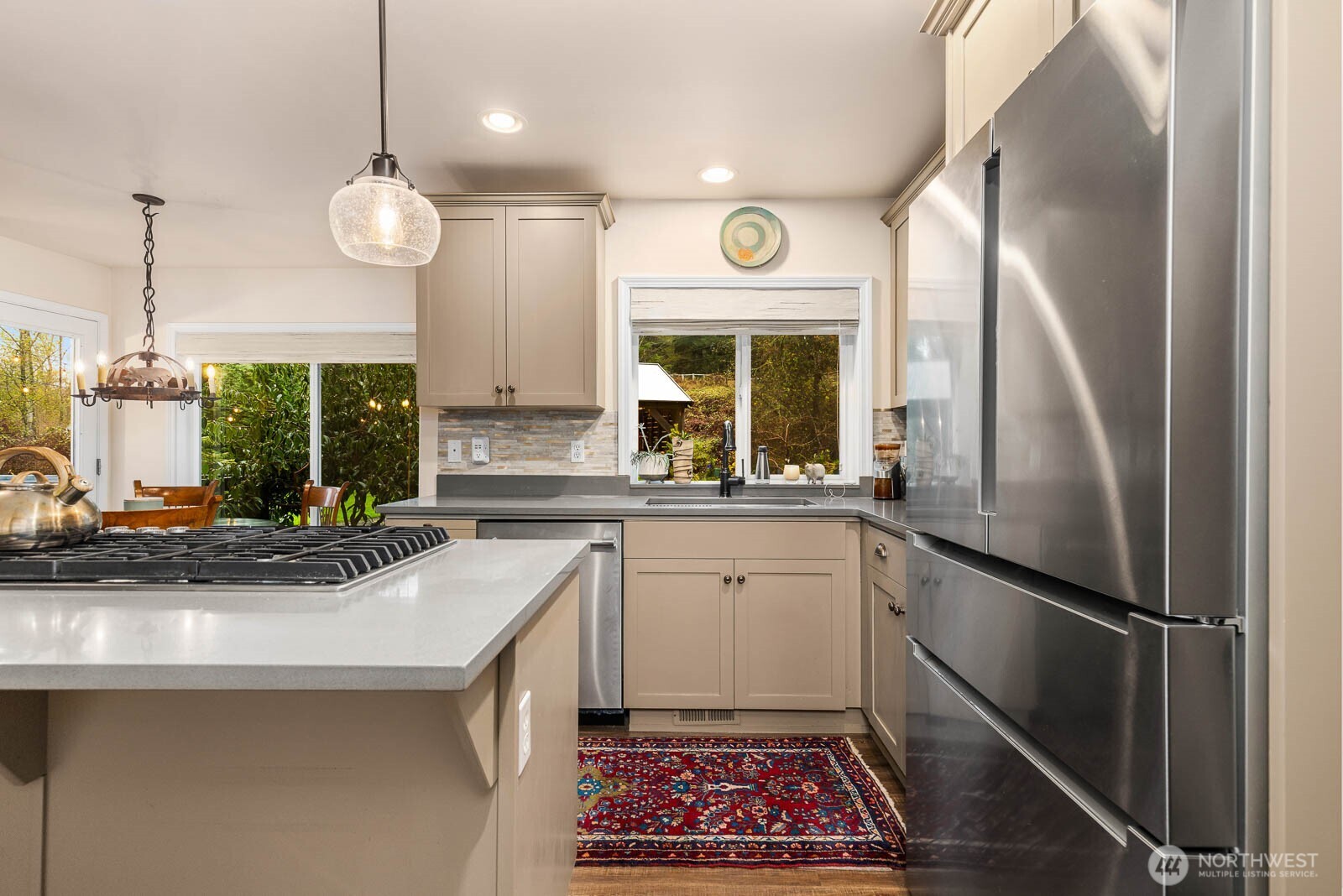 20928 Welch Road Snohomish, WA 98296 - Photo 5 of 29 a kitchen with a sink stainless steel appliances a counter space and a window