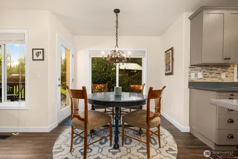a view of a dining room with furniture and window