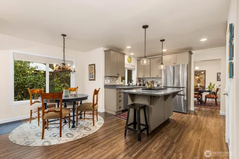 a view of a dining room with furniture window and outside view