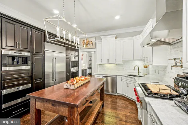a white bath tub sitting in a bathroom next to a window