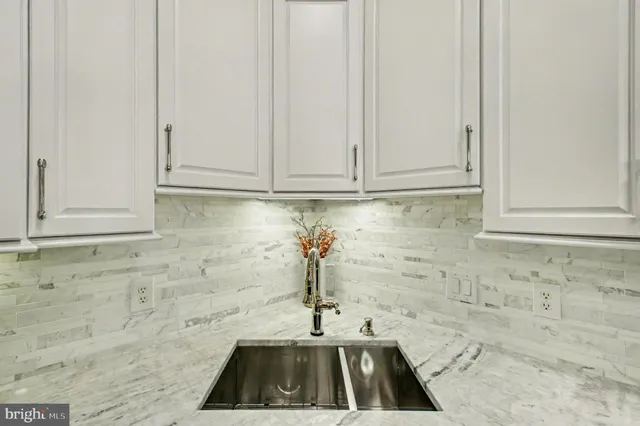 a bedroom with a bed and flat screen tv