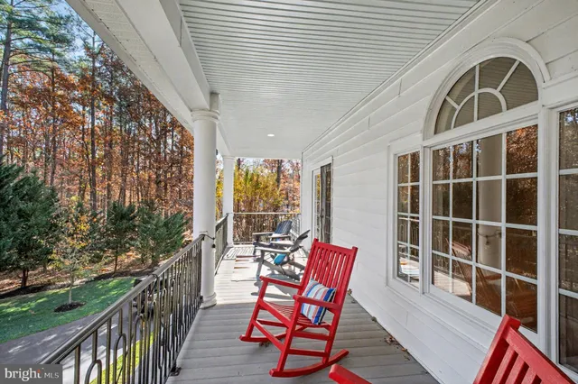 an aerial view of house with yard swimming pool and outdoor seating
