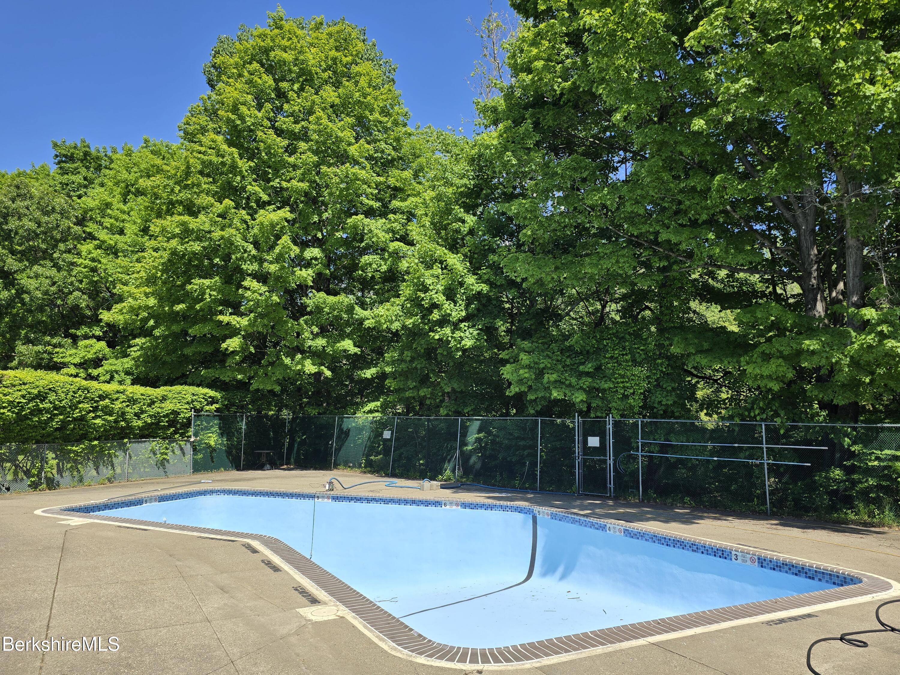 555 Russell Road, Unit J 65 Westfield, MA 01085 - Photo 17 of 20 a view of a swimming pool with a yard