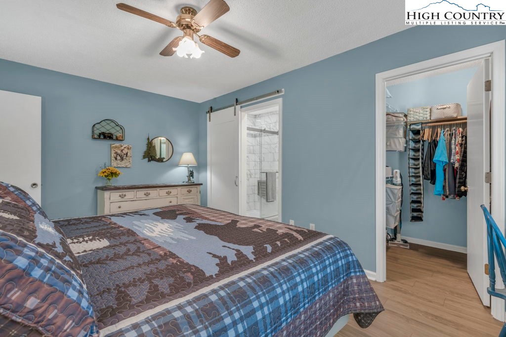 6 Ridgewood Lane Newland, NC 28657 - Photo 16 of 45 a bedroom with a bed and wooden floor