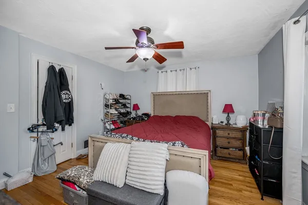 a bedroom with furniture and a bed