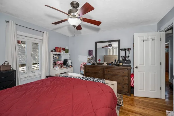 a bed room with a bed and a chandelier