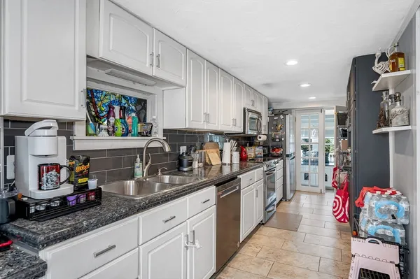 a kitchen with granite countertop lots of counter top space