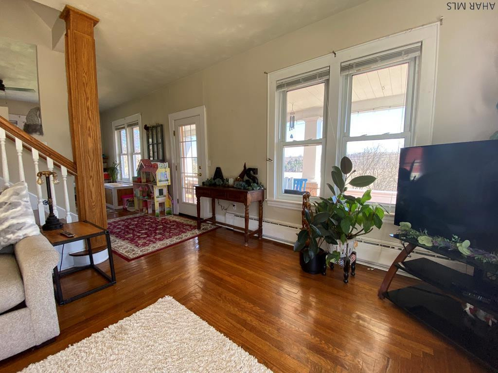 165 Springview Road Schellsburg, PA 15559 - Photo 6 of 63 a living room with furniture rug and wooden floor