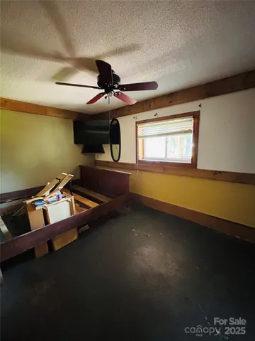 a room with pool table and windows