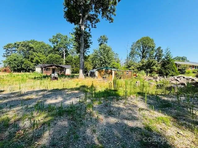 a view of swimming pool with a yard