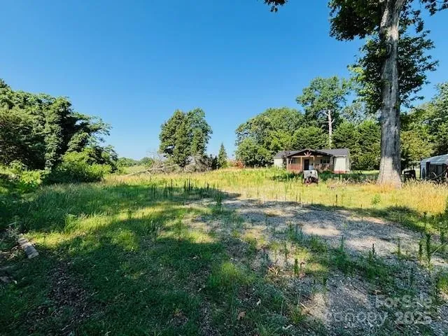 a view of swimming pool with a yard