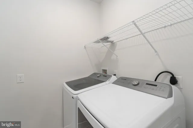 a kitchen with a sink and white cabinets